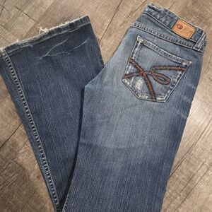 Buckle Women’s Flare Jeans - Medium Blue Denim with Brown Stitching